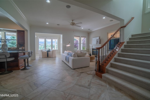 8270 Antler Pointe Ct, Reno, NV 89523 - living room with stairs, ceiling fan, crown molding, and recessed lighting