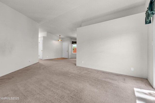 3353 Alpland Ln, Sparks, NV 89434 - spare room featuring carpet and lofted ceiling
