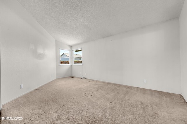 3353 Alpland Ln, Sparks, NV 89434 - carpeted empty room with a textured ceiling and vaulted ceiling