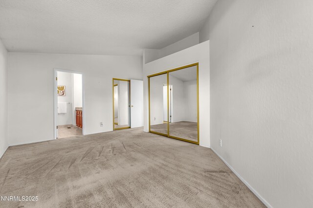 3353 Alpland Ln, Sparks, NV 89434 - unfurnished bedroom featuring lofted ceiling, carpet floors, and ensuite bathroom