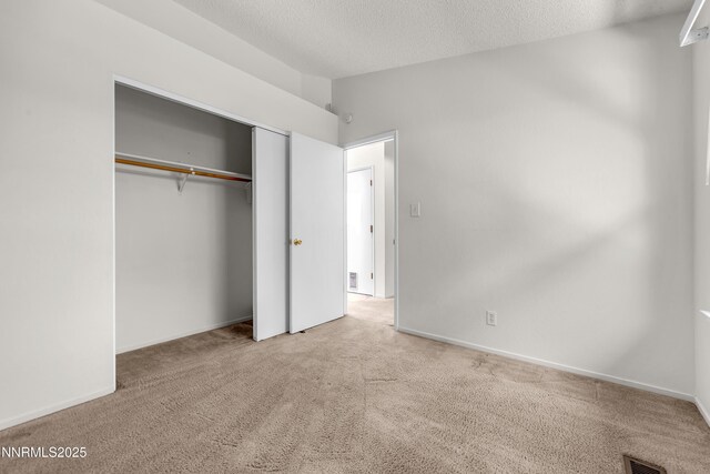 3353 Alpland Ln, Sparks, NV 89434 - unfurnished bedroom with carpet flooring, a closet, and a textured ceiling