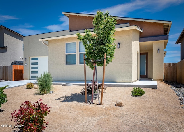 353 Radiant Dr, Carson City, NV 89705 - view of front facade with stucco siding and an attached garage