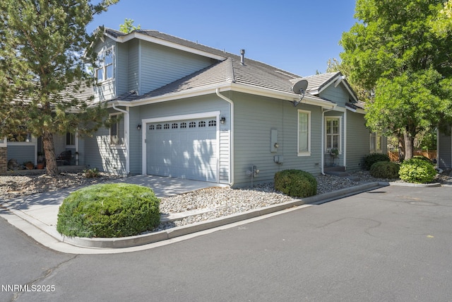 6694 Aston Cir, Sparks, NV 89436 - view of side of property featuring driveway and an attached garage