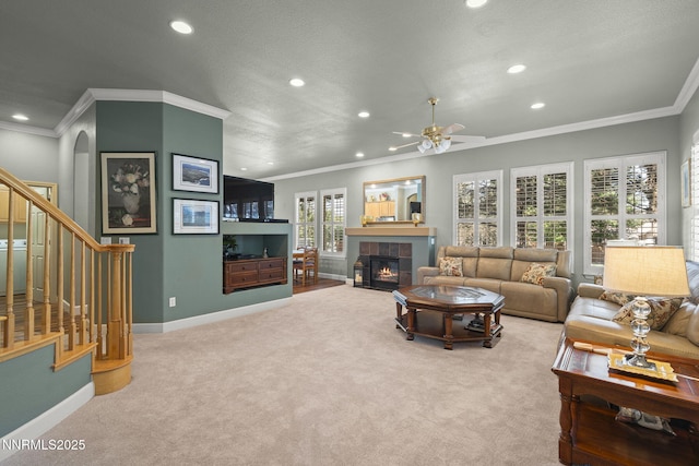 6694 Aston Cir, Sparks, NV 89436 - living area with recessed lighting, carpet flooring, a fireplace, crown molding, and ceiling fan