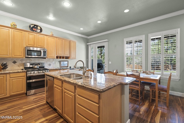 6694 Aston Cir, Sparks, NV 89436 - kitchen featuring stainless steel appliances, dark wood finished floors, tasteful backsplash, light stone counters, and recessed lighting