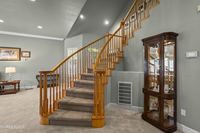 6694 Aston Cir, Sparks, NV 89436 - stairway featuring carpet, recessed lighting, and vaulted ceiling