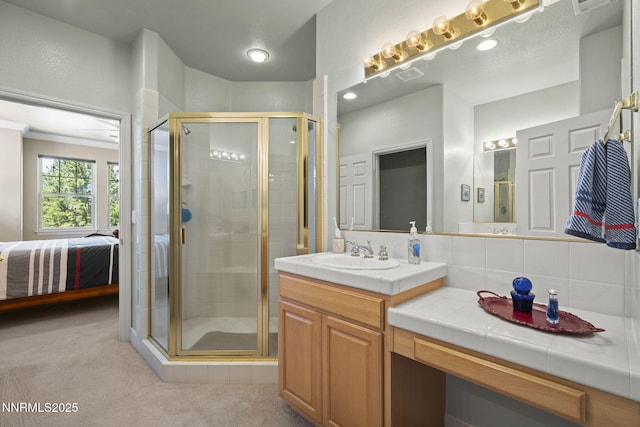 6694 Aston Cir, Sparks, NV 89436 - bathroom with vanity, connected bathroom, a shower stall, and tasteful backsplash