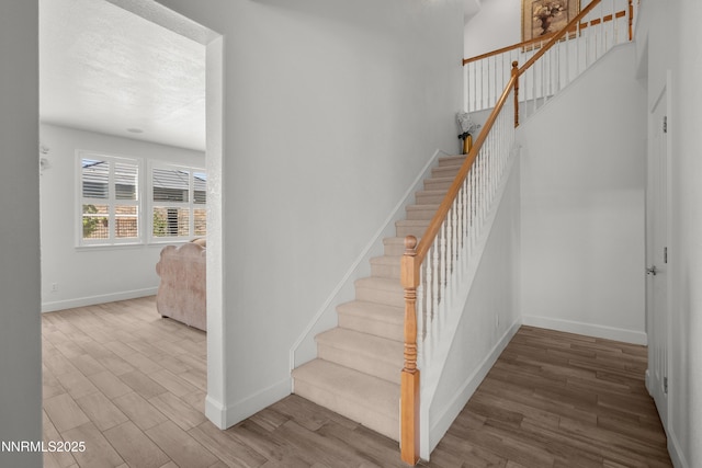 7935 Opal Station Dr, Reno, NV 89506 - staircase with baseboards and wood finished floors