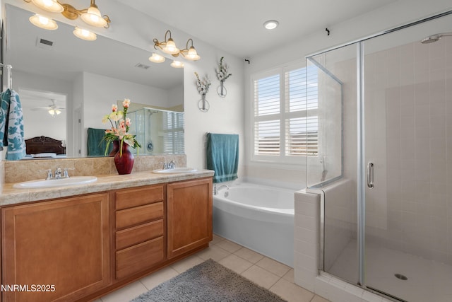 7935 Opal Station Dr, Reno, NV 89506 - ensuite bathroom with a bath, a stall shower, double vanity, tile patterned flooring, and ceiling fan