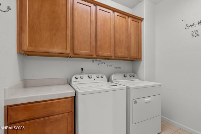 7935 Opal Station Dr, Reno, NV 89506 - laundry room featuring cabinet space, independent washer and dryer, and light tile patterned floors
