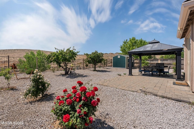 7935 Opal Station Dr, Reno, NV 89506 - fenced backyard with a patio area and a gazebo