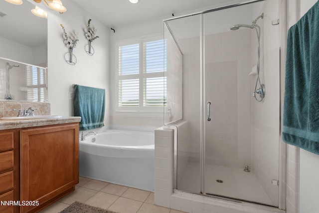 7935 Opal Station Dr, Reno, NV 89506 - bathroom with vanity, a bath, a stall shower, and tile patterned flooring