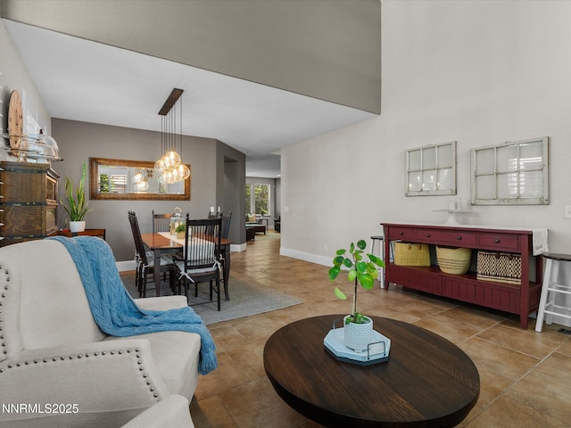 1121 Sageberry Ct, Reno, NV 89509 - tiled living area with a chandelier and baseboards