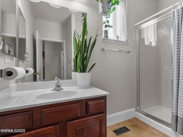 1121 Sageberry Ct, Reno, NV 89509 - bathroom with a shower stall, vanity, tile patterned flooring, and baseboards
