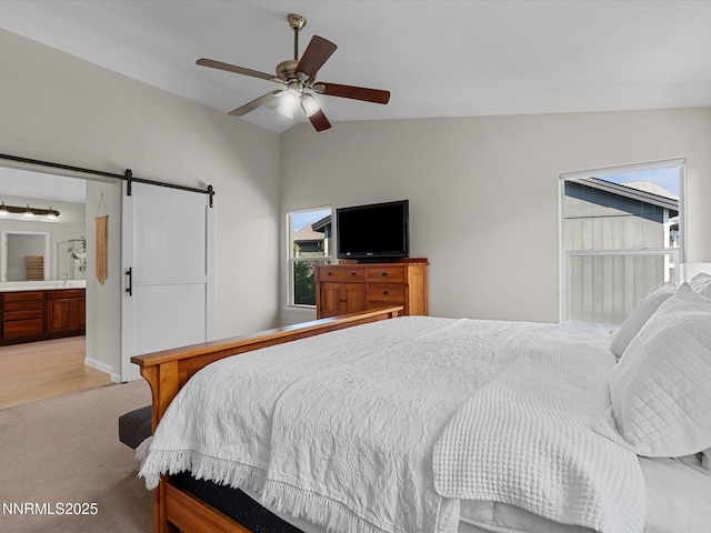 1121 Sageberry Ct, Reno, NV 89509 - bedroom with lofted ceiling, a barn door, light carpet, a ceiling fan, and ensuite bathroom