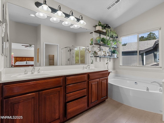 1121 Sageberry Ct, Reno, NV 89509 - ensuite bathroom with a shower stall, double vanity, plenty of natural light, a bath, and lofted ceiling