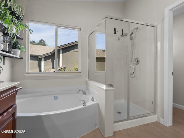 1121 Sageberry Ct, Reno, NV 89509 - full bath featuring a shower stall, a bath, vanity, and wood finished floors