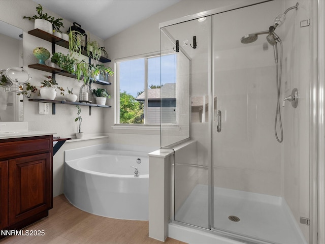 1121 Sageberry Ct, Reno, NV 89509 - bathroom featuring a stall shower, vanity, wood finished floors, and a garden tub