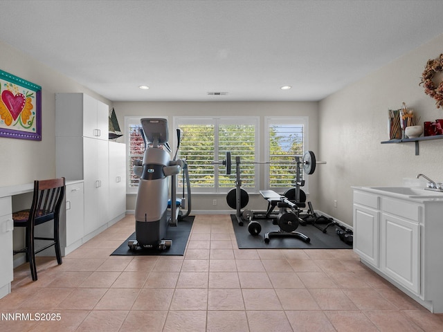 1121 Sageberry Ct, Reno, NV 89509 - workout area with a sink, light tile patterned floors, recessed lighting, and baseboards