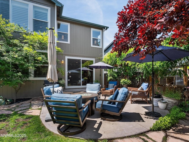 1121 Sageberry Ct, Reno, NV 89509 - view of patio / terrace with an outdoor living space with a fire pit