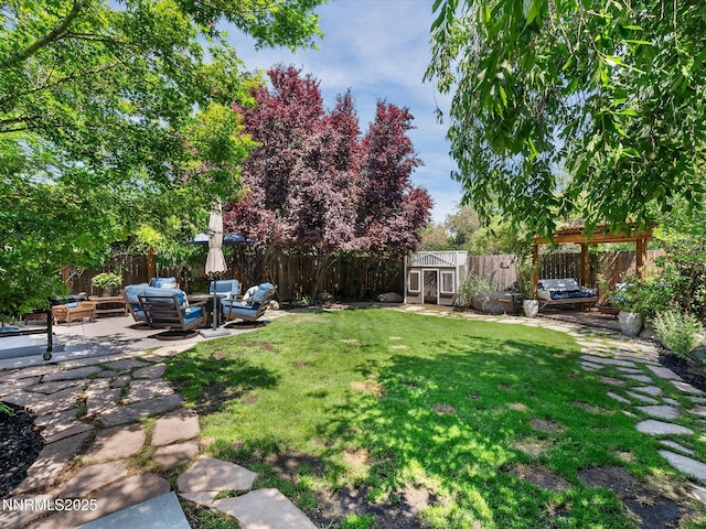 1121 Sageberry Ct, Reno, NV 89509 - view of yard featuring a patio area, an outdoor living space, and an outbuilding