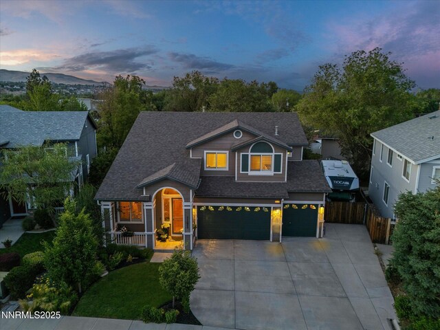 1121 Sageberry Ct, Reno, NV 89509 - view of front facade featuring driveway, a shingled roof, and an attached garage