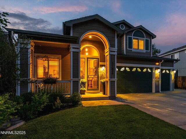 1121 Sageberry Ct, Reno, NV 89509 - view of front of house with driveway, a garage, a front yard, and a porch