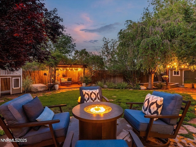1121 Sageberry Ct, Reno, NV 89509 - patio terrace at dusk with a patio and an outdoor living space with a fire pit