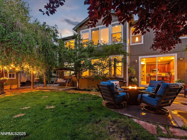 1121 Sageberry Ct, Reno, NV 89509 - back of property with a patio area, an outdoor fire pit, and a yard