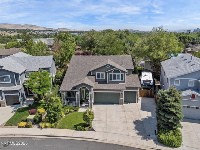 1121 Sageberry Ct, Reno, NV 89509 - view of front of property with driveway, a residential view, roof with shingles, an attached garage, and a mountain view