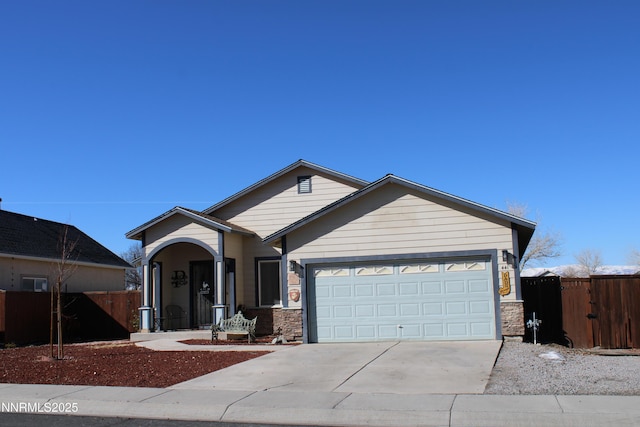 441 Dog Leg Dr, Fernley, NV 89408 - ranch-style home featuring driveway, a garage, and stone siding