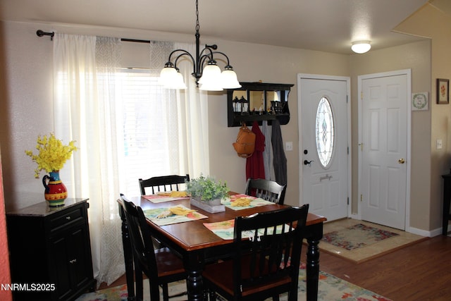 441 Dog Leg Dr, Fernley, NV 89408 - dining area featuring a chandelier and light wood-style flooring