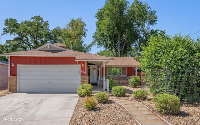 423 Bath St, Carson City, NV 89703 - ranch-style home with a garage, roof with shingles, driveway, and brick siding