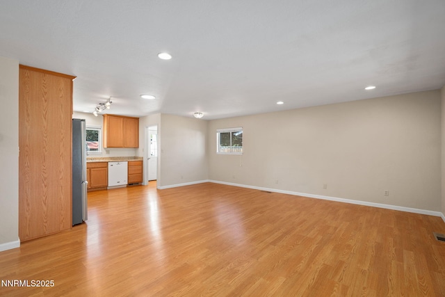 423 Bath St, Carson City, NV 89703 - unfurnished living room featuring light wood-type flooring and recessed lighting