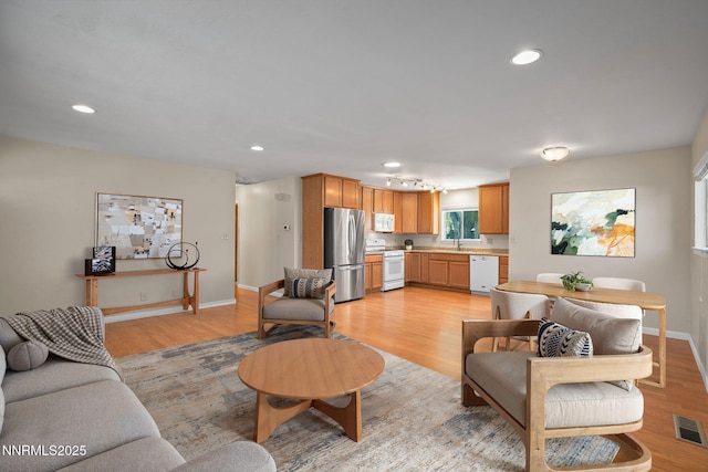 423 Bath St, Carson City, NV 89703 - living area featuring light wood finished floors and recessed lighting