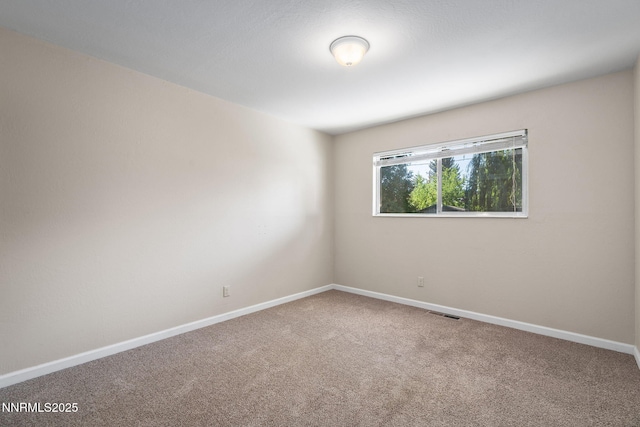 423 Bath St, Carson City, NV 89703 - spare room featuring carpet flooring and baseboards