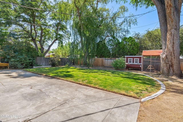 423 Bath St, Carson City, NV 89703 - fenced backyard featuring an outdoor structure and a patio