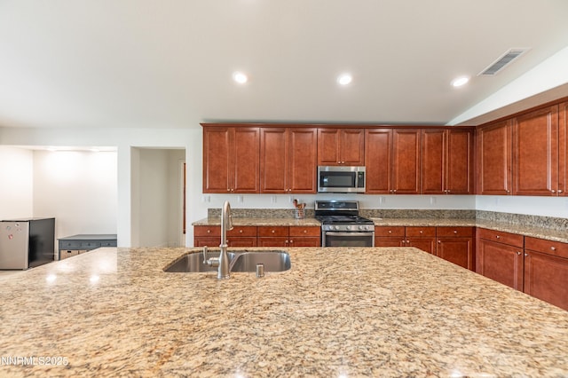 3720 Zoroaster Ct, Sparks, NV 89436 - kitchen with stainless steel appliances, a sink, light stone countertops, and recessed lighting