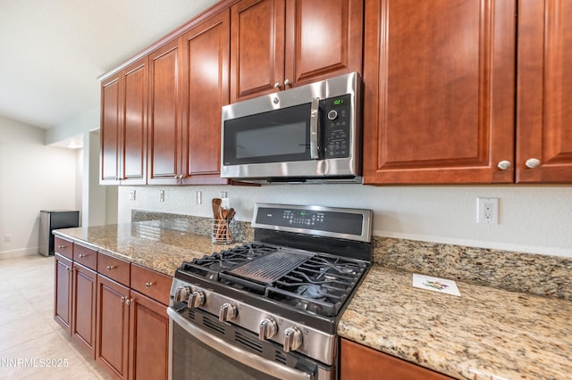 3720 Zoroaster Ct, Sparks, NV 89436 - kitchen featuring stainless steel appliances, light stone counters, light tile patterned flooring, and baseboards