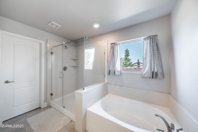 3720 Zoroaster Ct, Sparks, NV 89436 - bathroom featuring a garden tub, a stall shower, tile patterned flooring, and recessed lighting