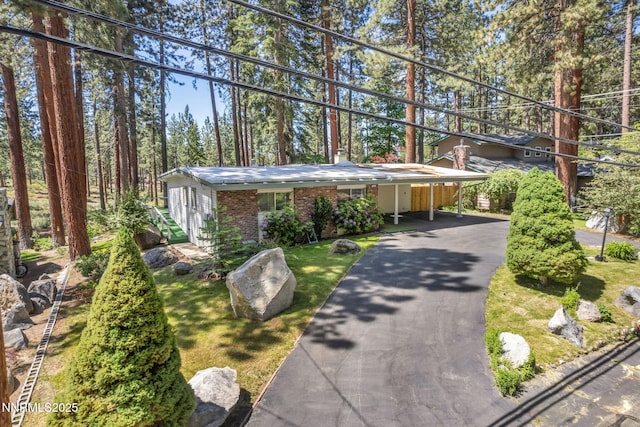 161 Willow Dr, Zephyr Cove, NV 89448 - view of front of house featuring brick siding, asphalt driveway, and a carport