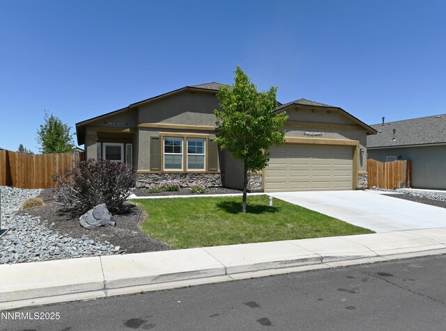 226 Red Oak Dr, Fernley, NV 89408 - single story home featuring stone siding, a garage, driveway, and stucco siding