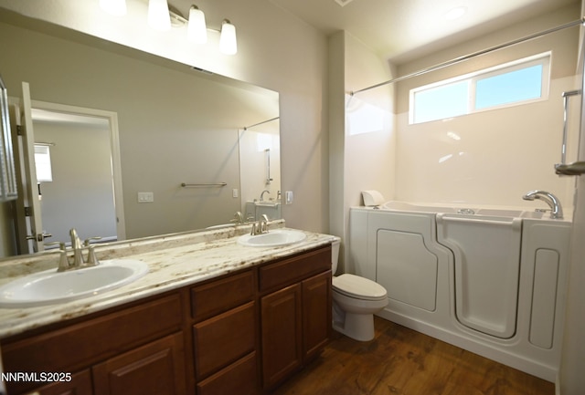 226 Red Oak Dr, Fernley, NV 89408 - bathroom featuring shower / washtub combination, double vanity, and wood finished floors