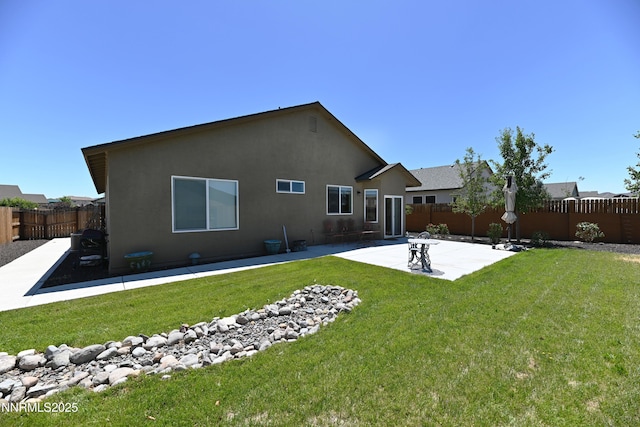 226 Red Oak Dr, Fernley, NV 89408 - rear view of property with a patio, a fenced backyard, and stucco siding