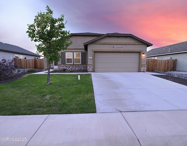 226 Red Oak Dr, Fernley, NV 89408 - ranch-style home with stone siding, a garage, concrete driveway, and stucco siding