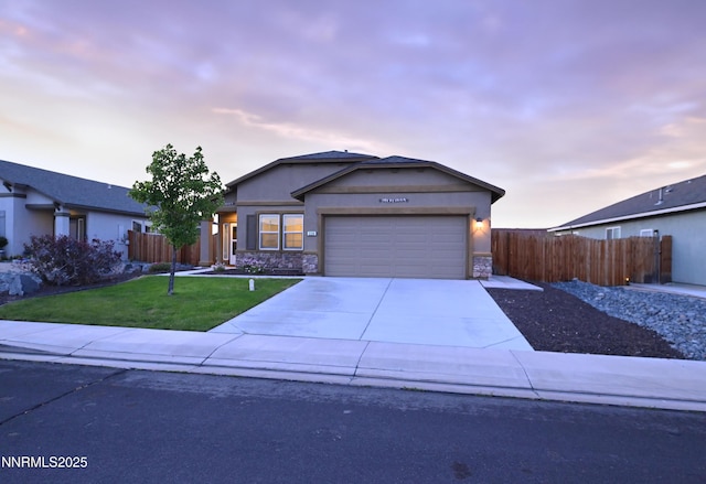 226 Red Oak Dr, Fernley, NV 89408 - ranch-style house featuring a garage, stone siding, driveway, and stucco siding