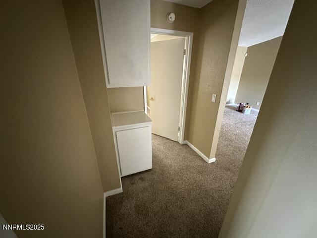 10083 Zeolite Dr, Reno, NV 89506 - corridor featuring carpet and baseboards