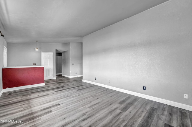 650 E York Way, Sparks, NV 89431 - unfurnished living room featuring baseboards and wood finished floors