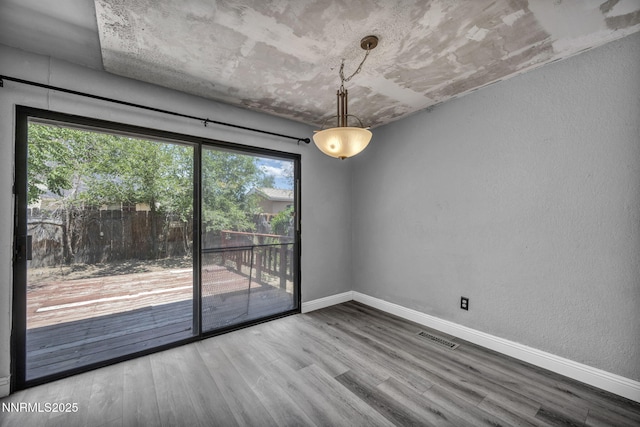 650 E York Way, Sparks, NV 89431 - unfurnished room featuring wood finished floors and a textured wall