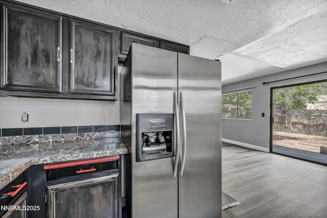 650 E York Way, Sparks, NV 89431 - kitchen with stainless steel refrigerator with ice dispenser, a textured ceiling, and wood finished floors